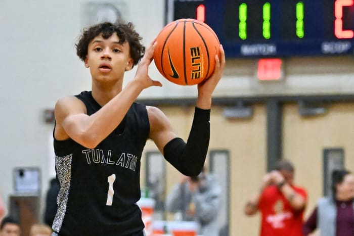 Tualatin sophomore Jemai Lake surveys the floor during a first-round Les Schwab Invitational loss to Beaverton on Dec. 26 at Liberty High School.